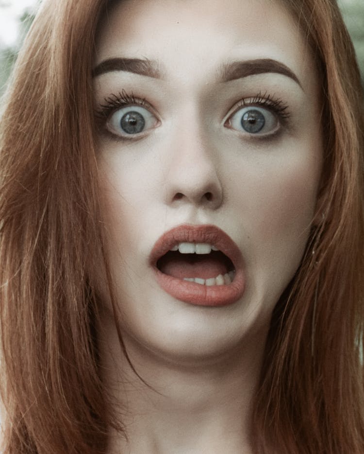 Close-up Photo Of A Shocked Woman's Face