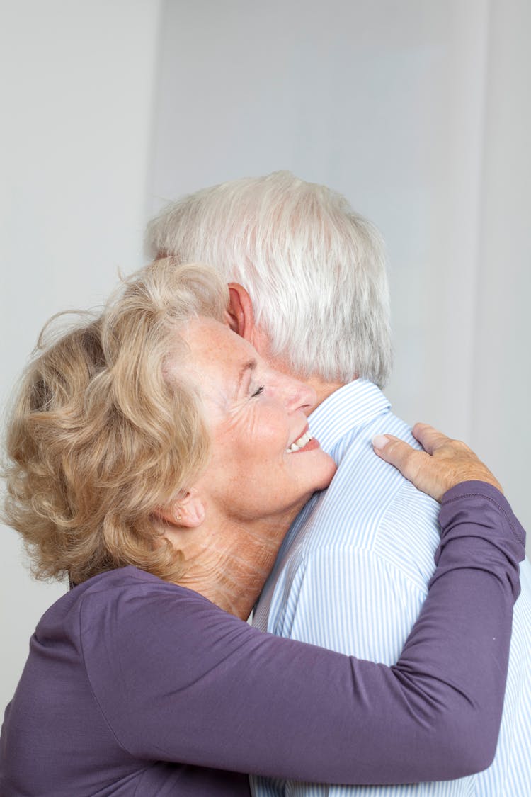 Happy Elderly Couple Hugging