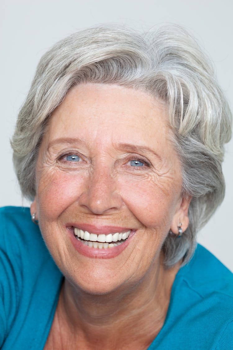 Portrait Of Smiling Old Grey-Haired Woman