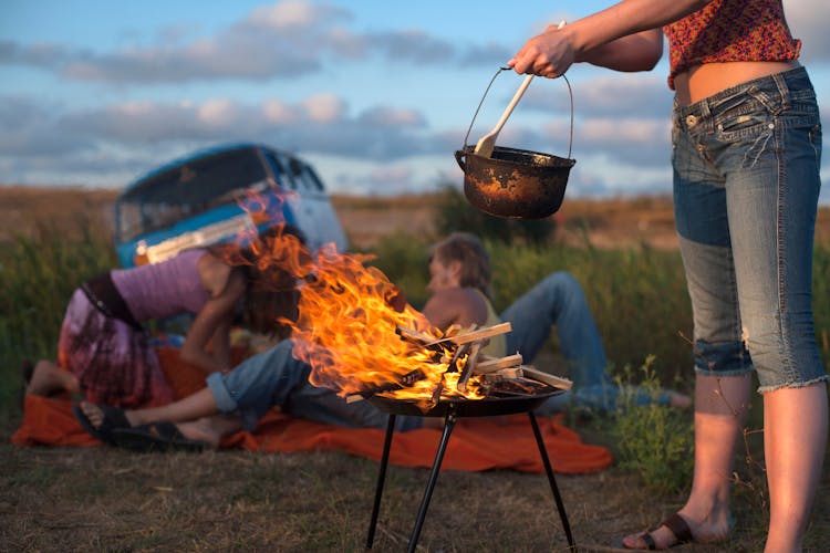 People Relaxing On Camping