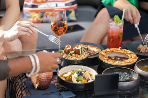 People Eating at a Cafe Table