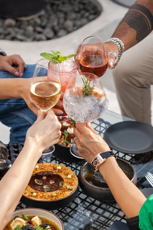 People Toasting Glasses with Alcoholic Drinks