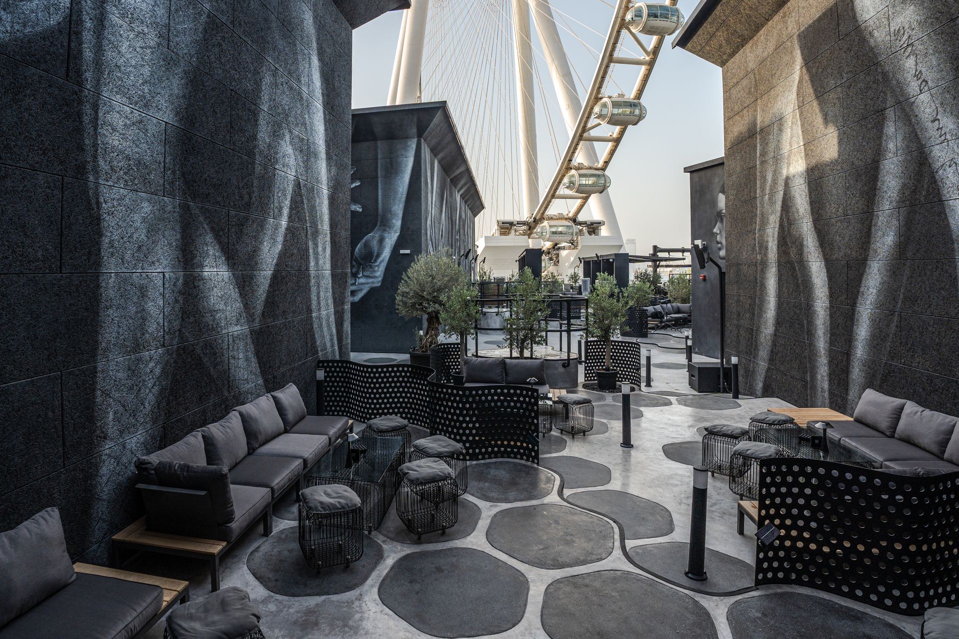 Stylish outdoor terrace with a view of Dubai's iconic ferris wheel.
