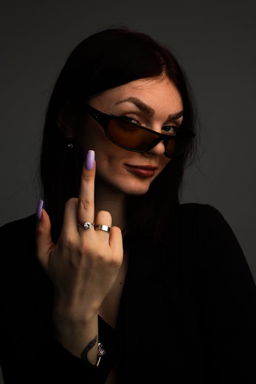 Free Brunette Woman Showing Middle Finger Stock Photo