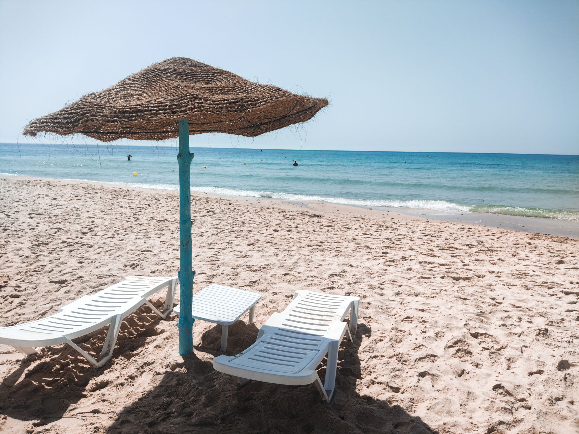 White Lounge Chair on Beach · Free Stock Photo