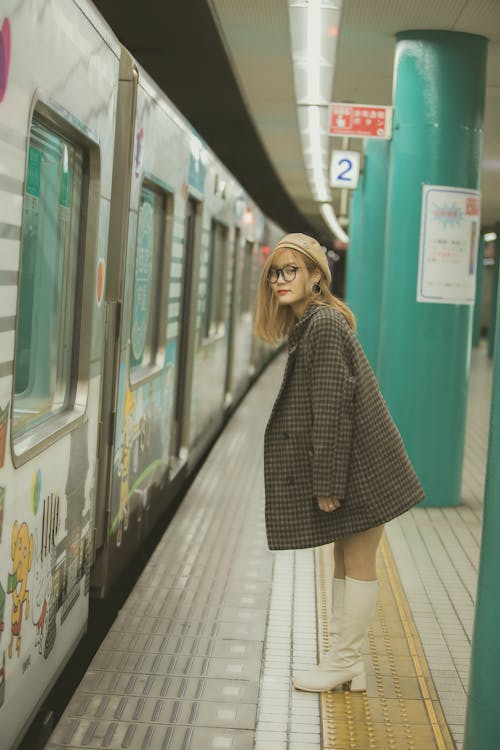 Woman in Checkered Blazer Waiting for the Train