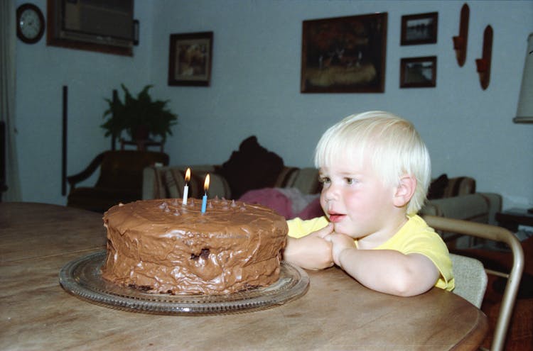 Boy Sitting With Birthday Cake