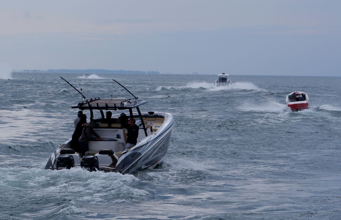 People Riding a Motorboat on Sea · Free Stock Photo