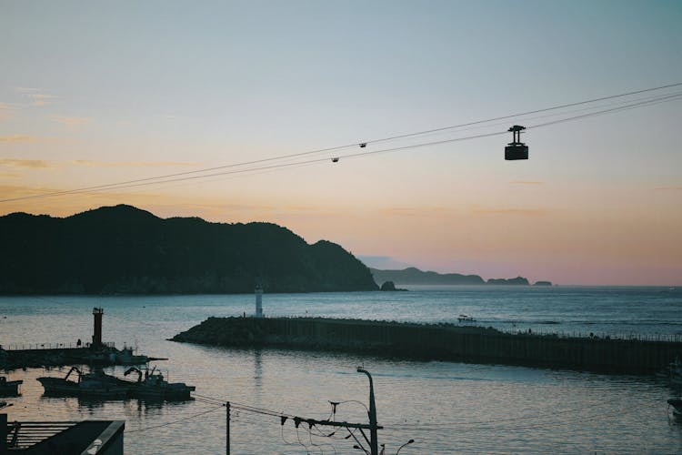 Silhouette Of A Cable Car Over The Sea