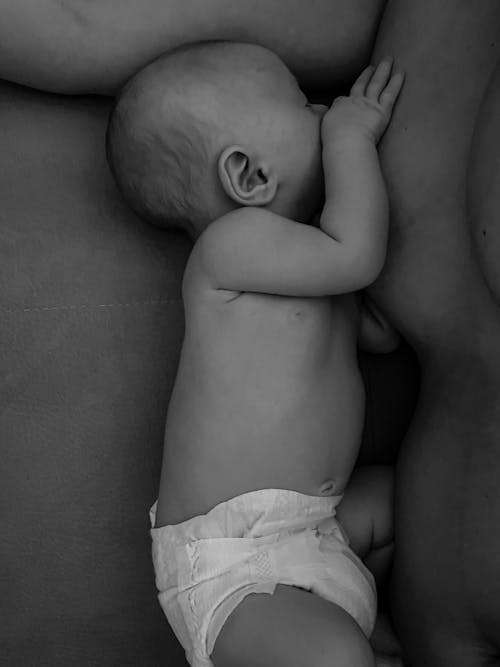 Grayscale Photo of a Topless Baby