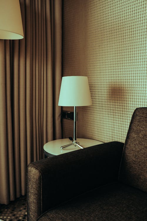 Free White and Silver Table Lamp on Brown Round Table Stock Photo