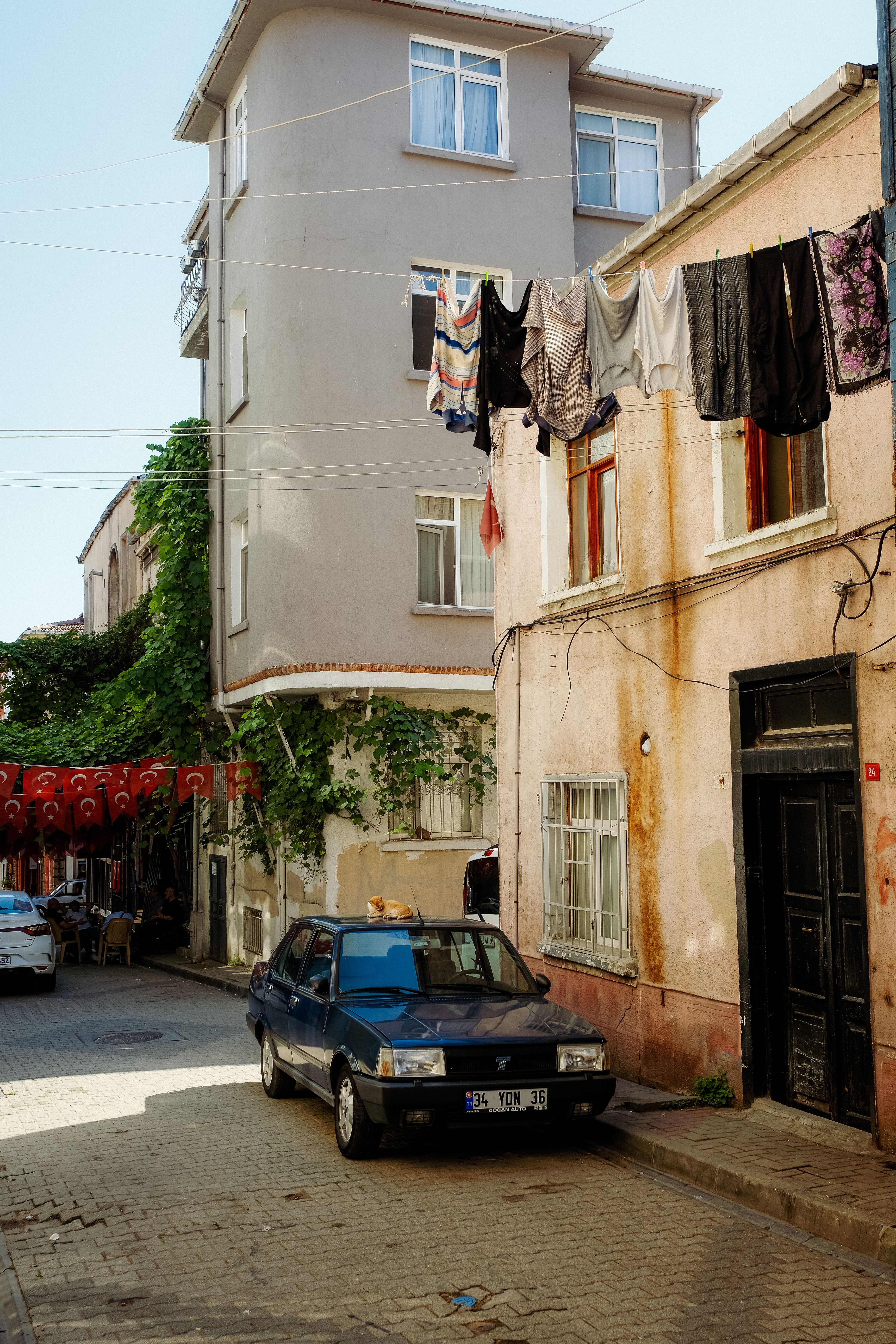 A Black Car Parked on the Side of a Street · Free Stock Photo