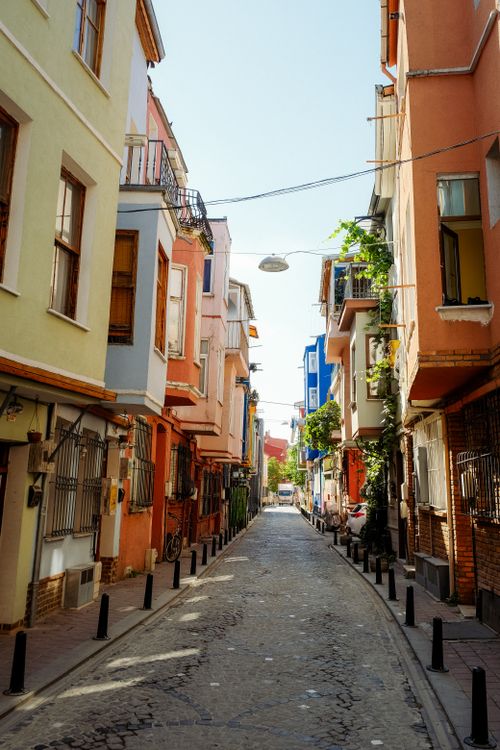 Free Colorful narrow street flanked by vibrant buildings, capturing urban charm. Stock Photo