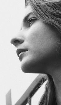 Black and white portrait of a woman gazing into the distance in Kyiv.