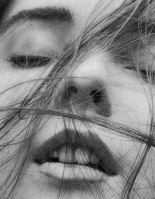 Grayscale Photo of Hair on Woman's Face