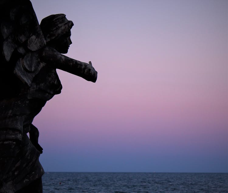 Sculpture Against Sky And Sea