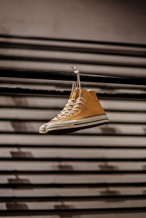 Hanging Yellow Converse High Top Sneakers