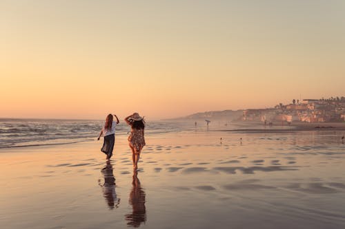 Women Walking on the Beach
