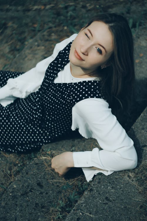 Beautiful Woman Sitting and Blinking 