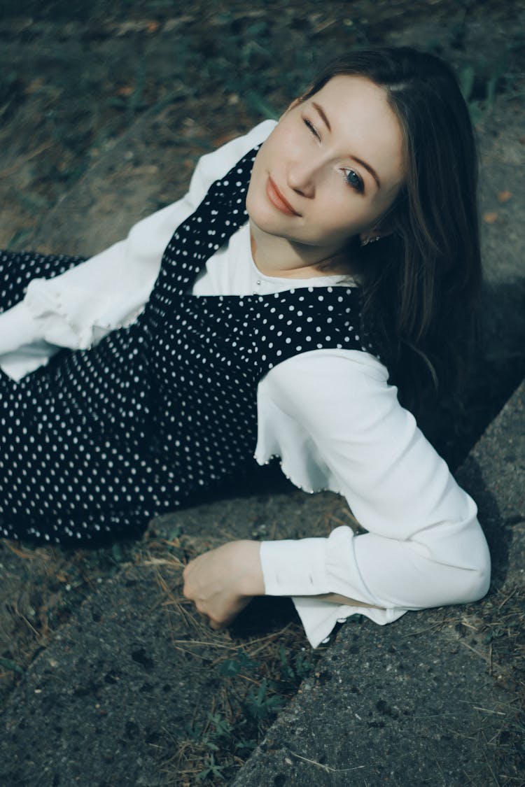 Beautiful Woman Sitting And Blinking 