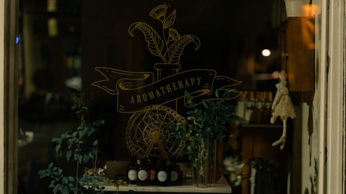 Free Elegant aromatherapy products are displayed in a cozy Istanbul shop window, accentuated by soft lighting. Stock Photo