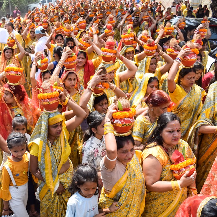 Women In Sari Carrying Clay Pots