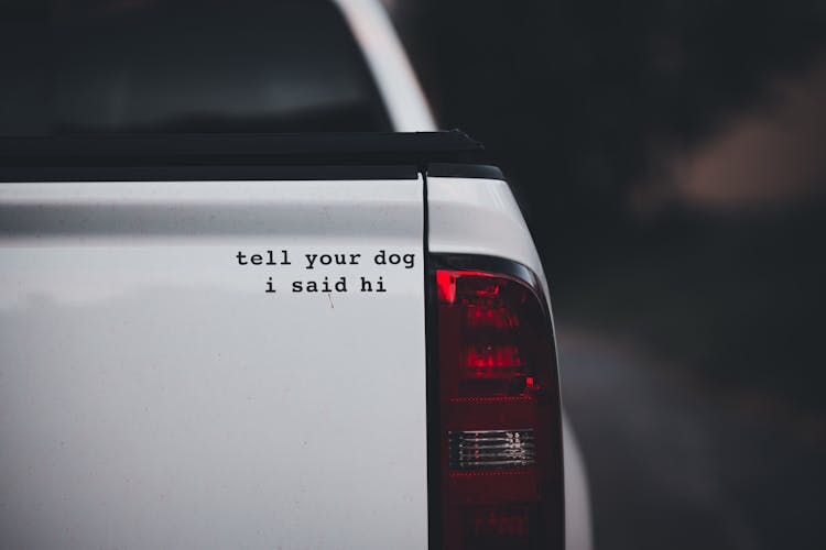 White Pick Up Truck With A Sticker