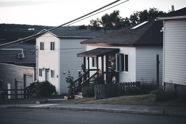 Residential street with houses at dusk