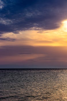 Stunning sunset with vivid colors over the Aegean Sea in Nea Irakleia, Greece.