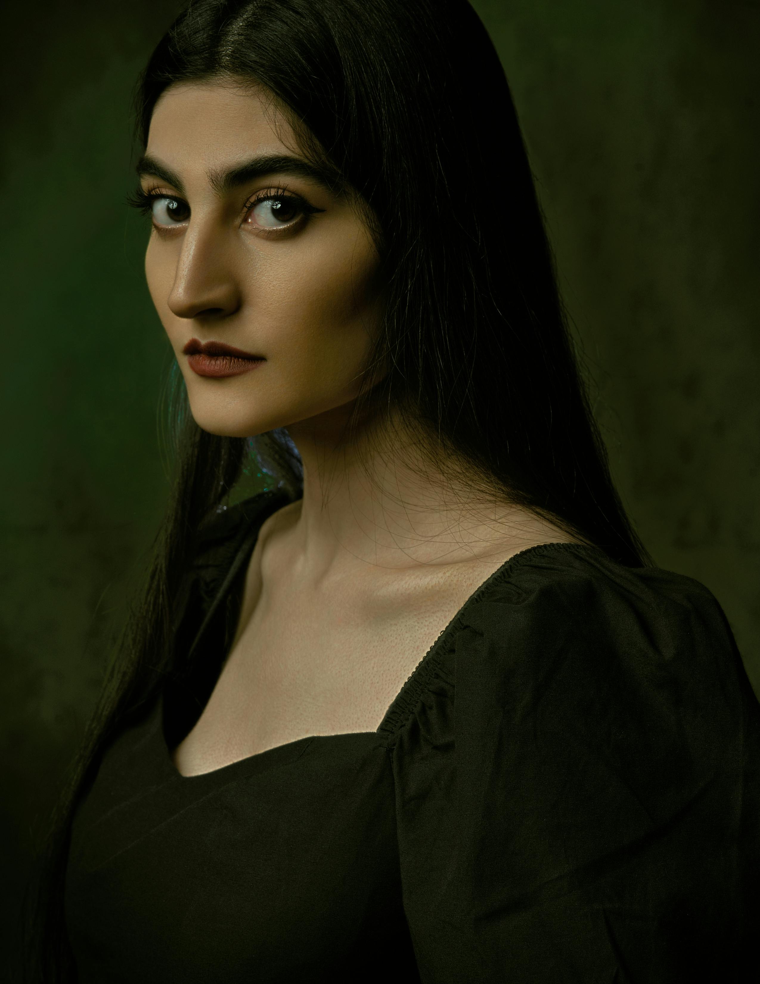 portrait photography of young woman with beautiful big black eyes