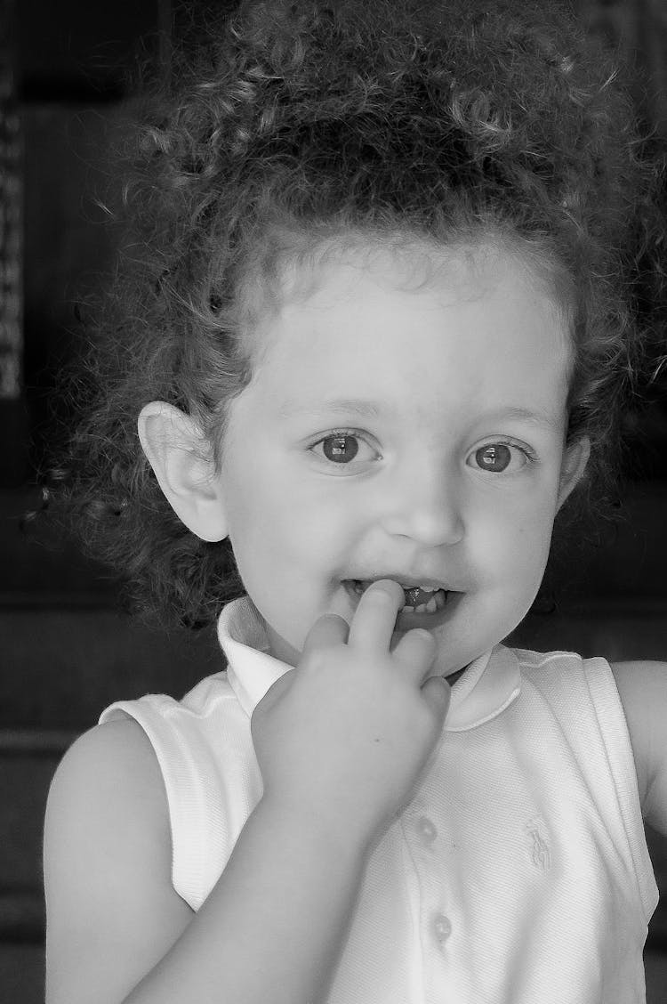 Child Biting Her Finger