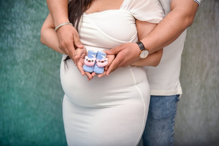 A Couple Holding Infant Socks