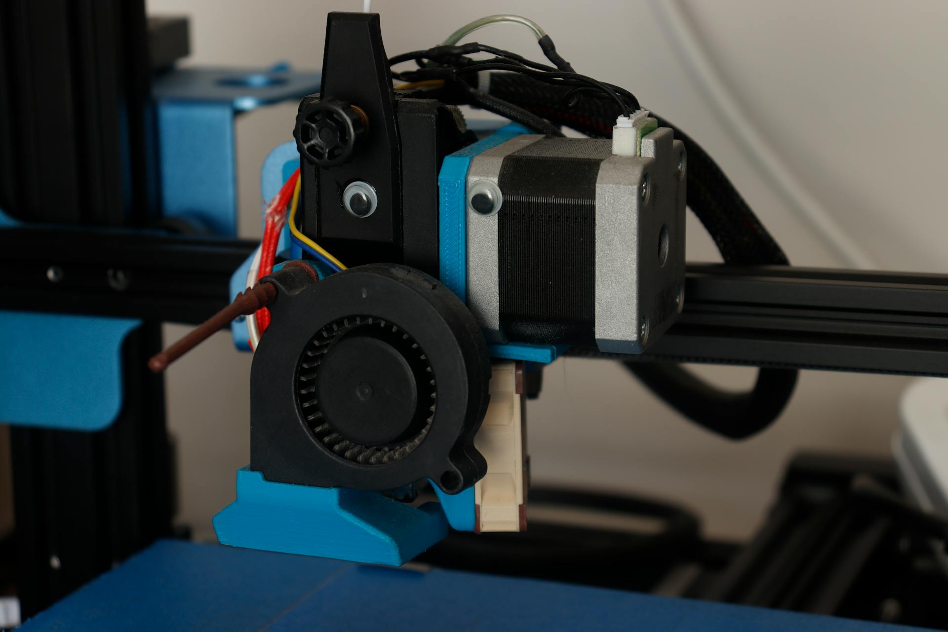 Detailed view of a 3D printer component showcasing its technology and design.