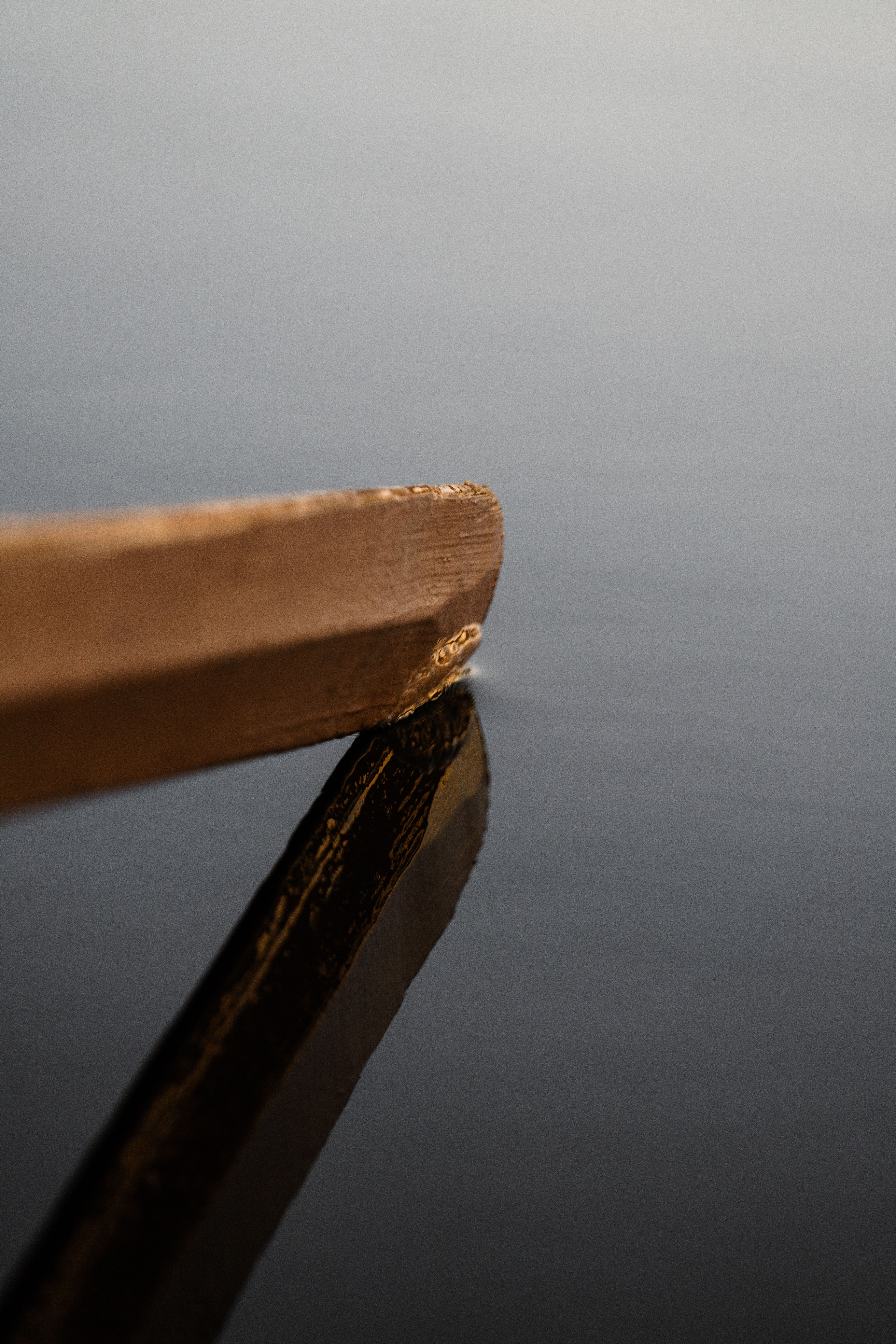 Close-up Photo of a Reflection of Wood on Water · Free Stock Photo