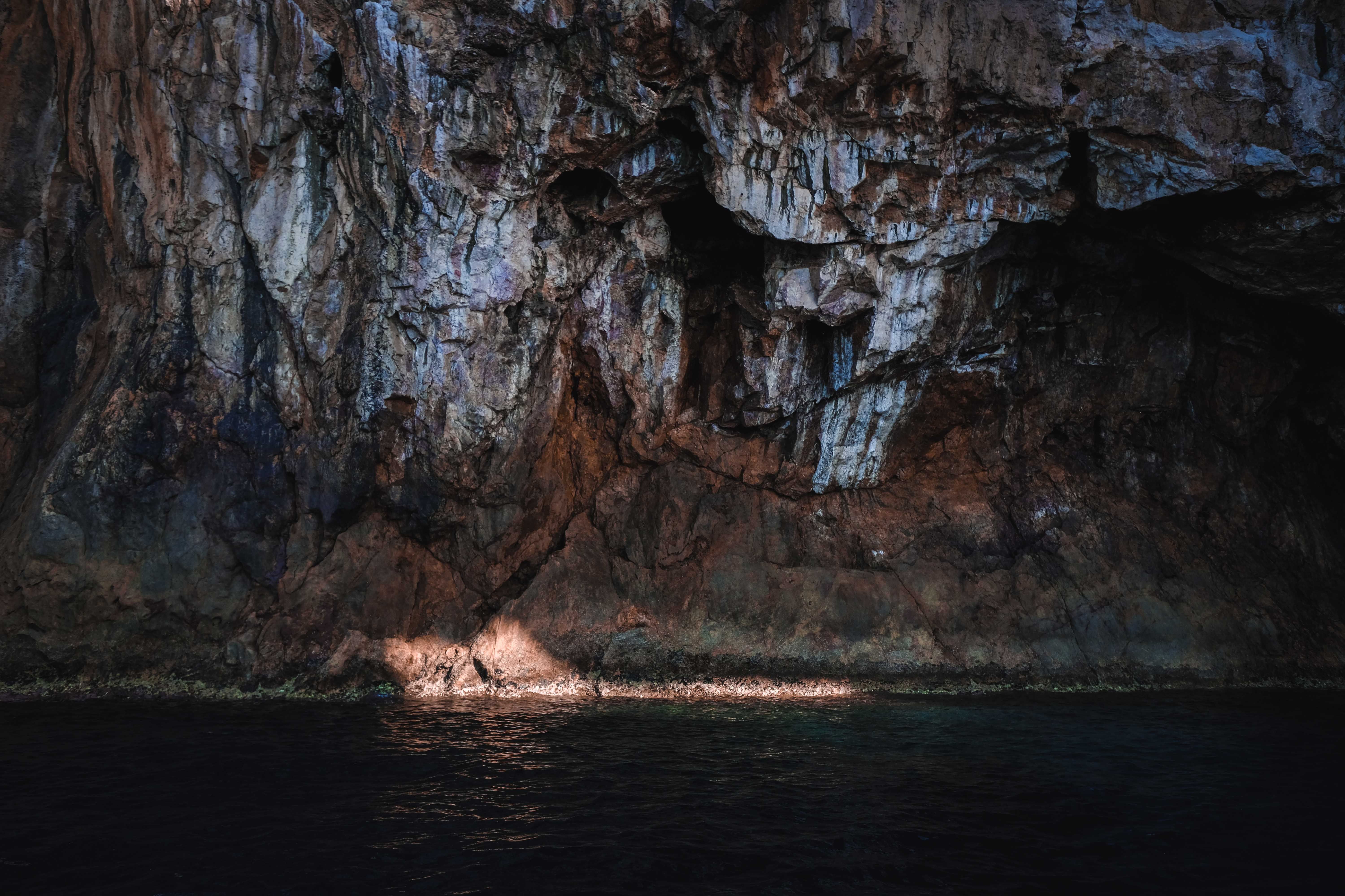 Brown Rock Formation on Sea · Free Stock Photo