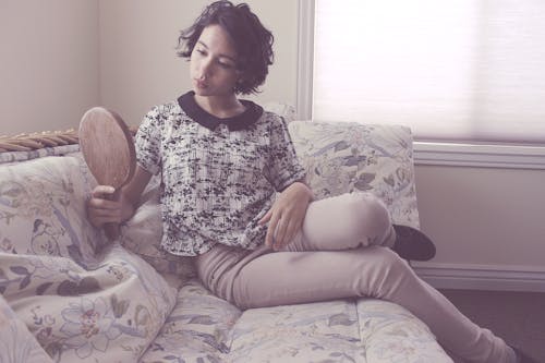 Free Woman Looking at Mirror Stock Photo