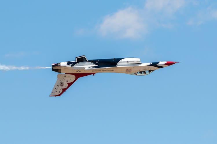 White And Red Jet Plane In Mid Air