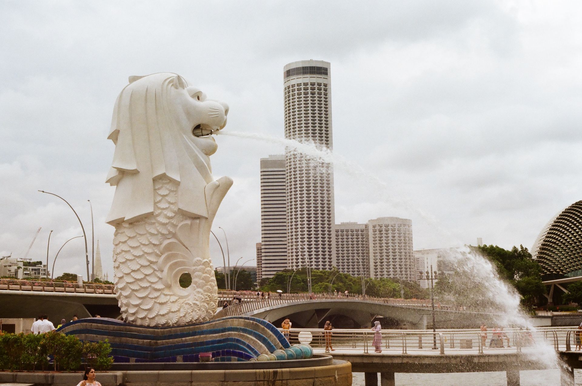 White Concrete Statue Near Body of Water