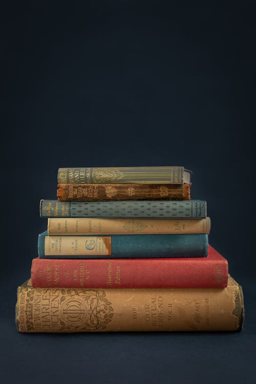 Piled Books on a Blue Surface