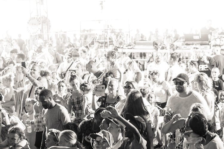 Grayscale Photo Of A Crowd