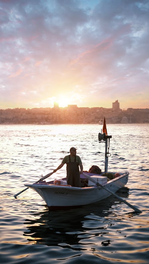 A Man Riding a Boat on the Sea