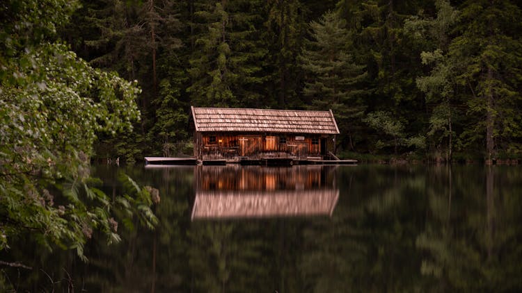 A Wooden House Floating On The Lake 