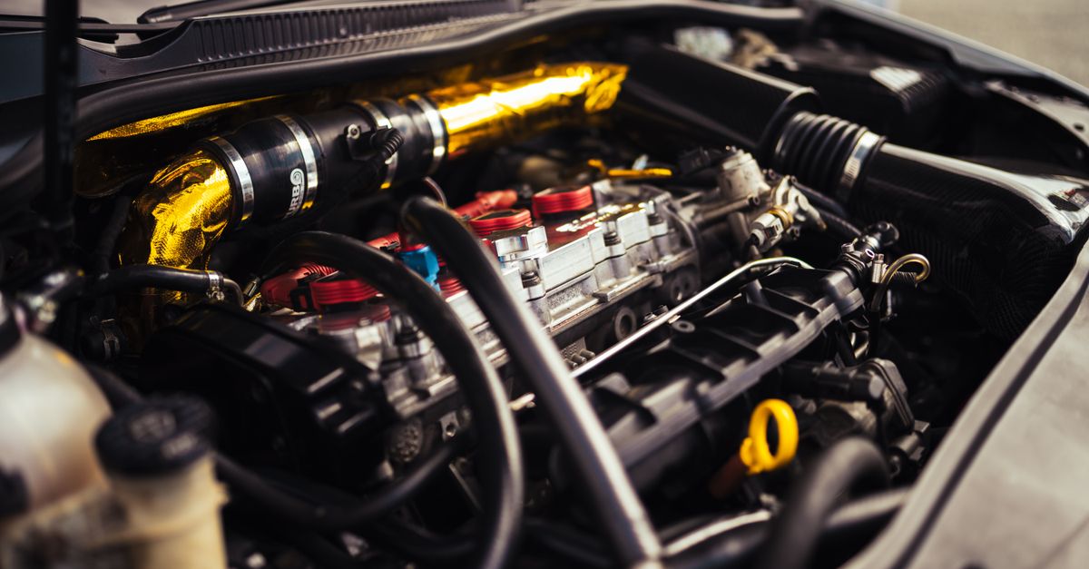 Close-up view of a high-performance car engine revealing intricate mechanical details.
