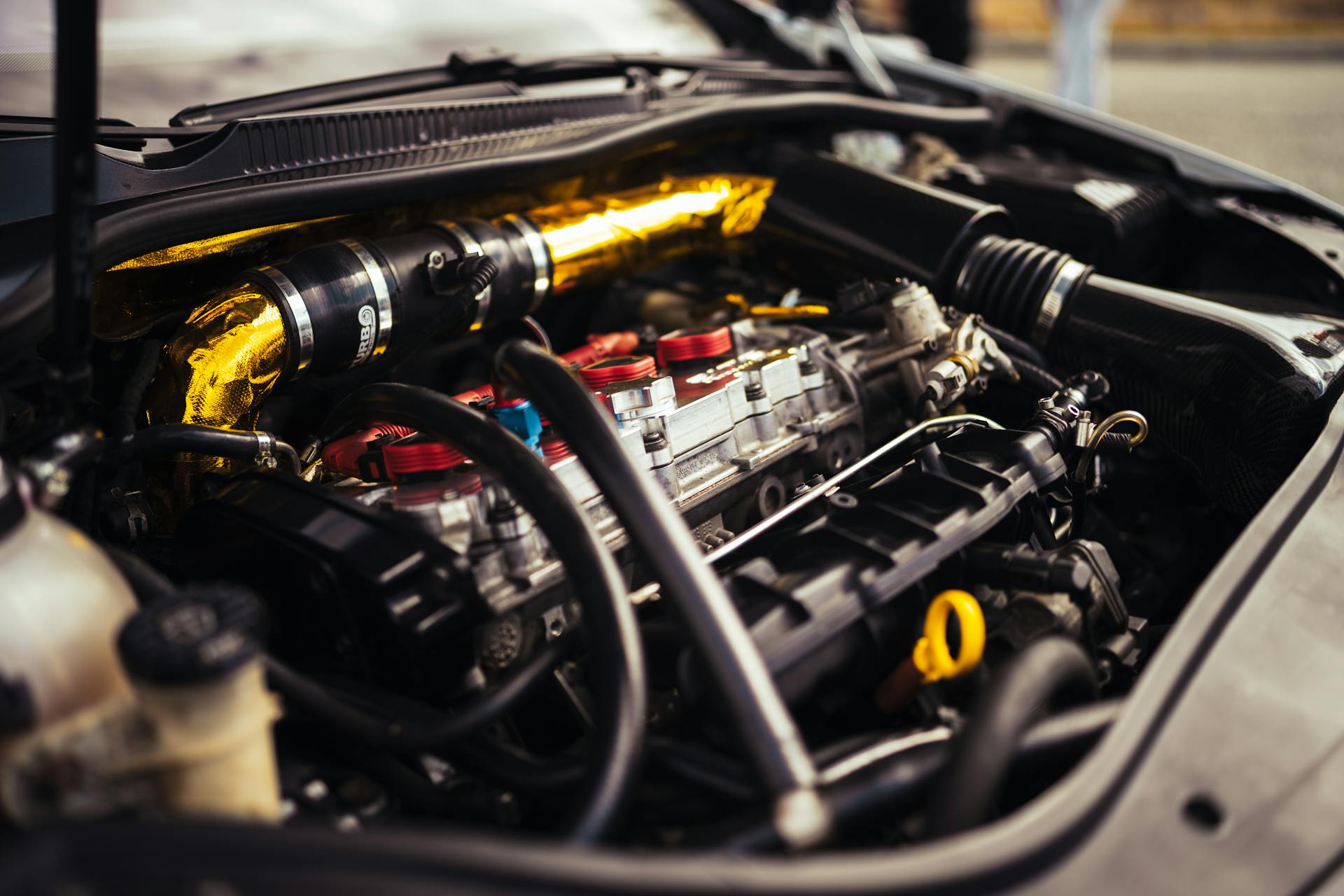 Close-up view of a high-performance car engine revealing intricate mechanical details.