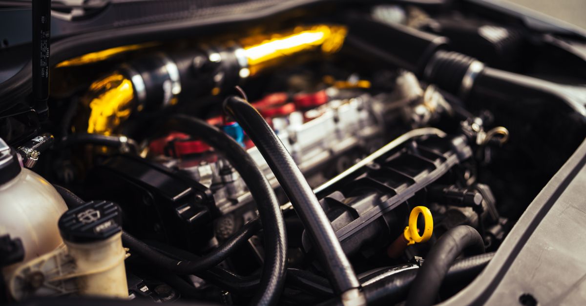 Detailed image of car engine components showcasing automotive engineering and mechanics.