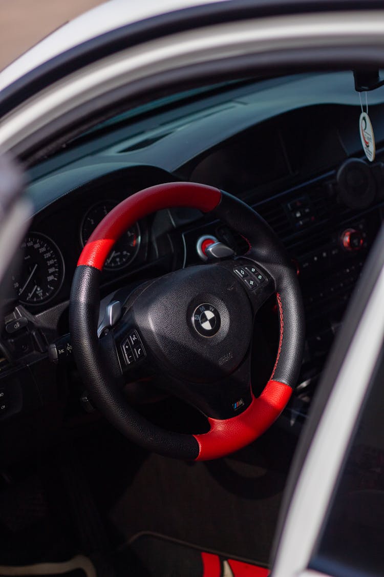 A Red And Black Steering Wheel