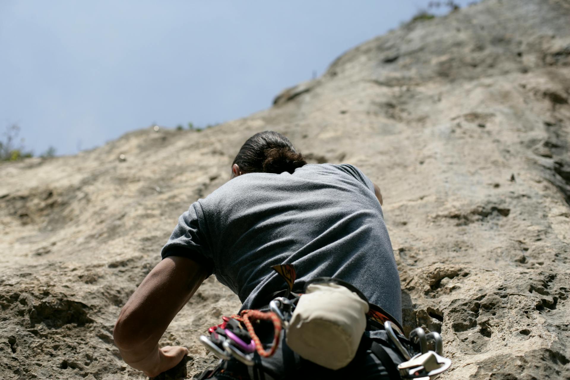 Photo of a Climbing Man on the Rock