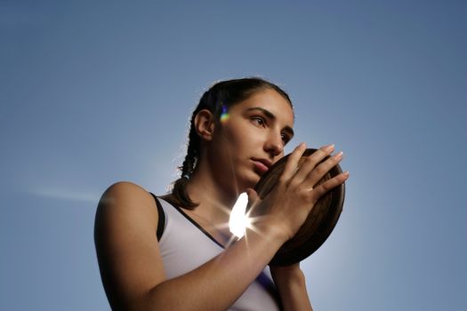 Girl Holding a Discus