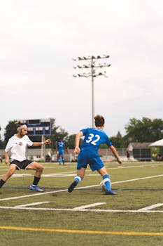 Players compete in a thrilling soccer match on a grass field in Gatineau, Quebec, Canada.