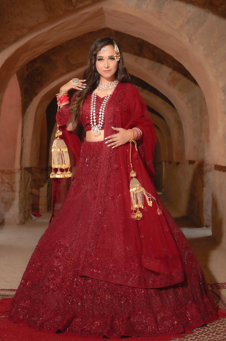 Woman In Red Sari Inside A Building